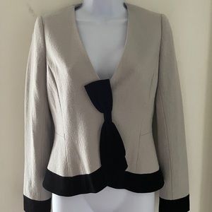 grey suit with super cute black bow.